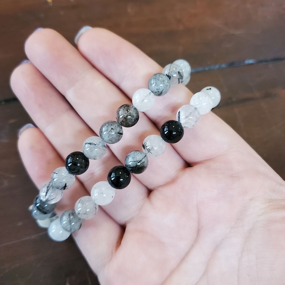 One (1) tourmalated quartz bracelet